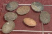Sling bullets of baked clay and stone found at Ham Hill Iron Age hill fort.